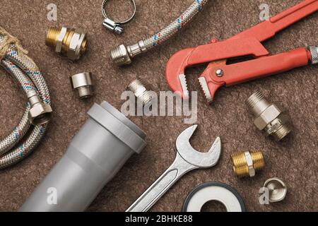 Various plumbing tools for connecting faucets and sewers, top view Stock Photo