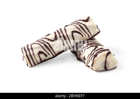 Cakes in white and dark chocolate icing isolated on white Stock Photo