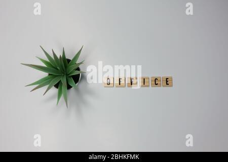 The word Office written in wooden letter tiles on a white background. Stock Photo