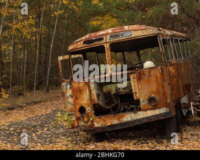 Scrap of a bus left after the Chernobyl disaster. Chernobyl Exclusion Zone, Ukraine. Stock Photo