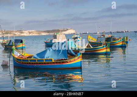 Luzzu fishing boats in harbour, Marsaxlokk, Malta Stock Photo