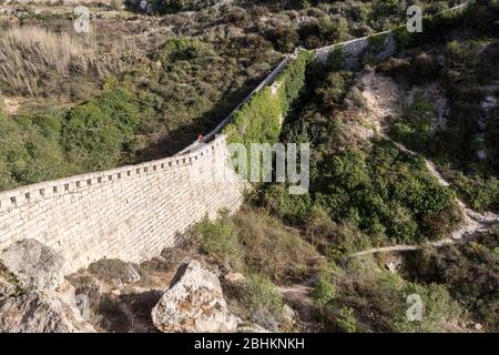Person on the wall of the Victoria Lines, Malta Stock Photo