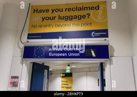 Manchester UK airport EU citizens arrival gate. Manchester airport terminal arrivals from the European Union gate with luggage sign. Stock Photo
