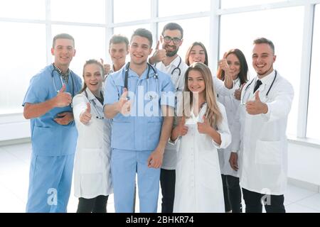 diverse medical professionals giving a thumbs up Stock Photo