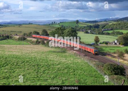 3 Royal Mail Class 325 postal trains pass Hincaster (north of Carnforth) on the scenic west coast mainline in Cumbria with a mail train Stock Photo