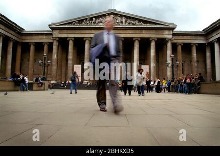 A smart suited man leaving the British Museum. Stock Photo