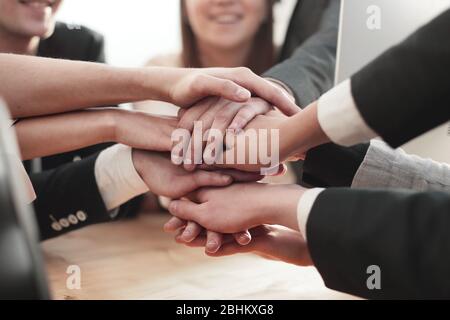 close up. young employees making a tower out of their hands Stock Photo