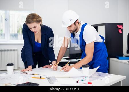 A Portrait Of Two Construction Designers Working On A Project. Stock Photo