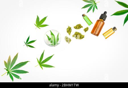 Assorted Medical Cannabis products CBD and THC oils lotion on flower buds isolated on white Stock Photo