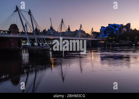 Hungerford Bridge, Golden Jubilee Bridges, Charing Cross Station and the Thames at twilight, London, UK Stock Photo