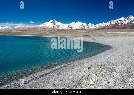 The shores of Peiku Lake, just below the snowline of the Himalayas, Tibet Stock Photo