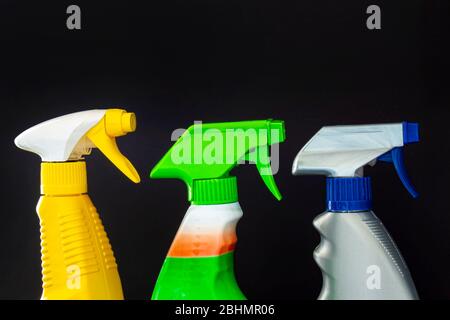 Close up of spray cleaners bottles on a black background Stock Photo
