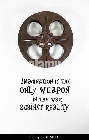 Film Reel Decor on a white wall with Imagination Quote Stock Photo