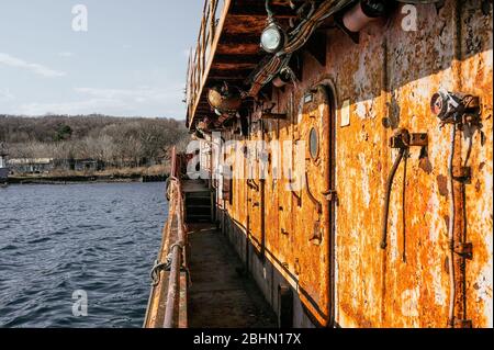 the deck of a very old abandoned completely rusty ship Stock Photo