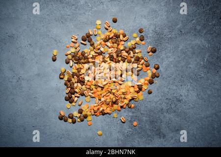 Mix of legumes and cereals on a stone table. Stock Photo