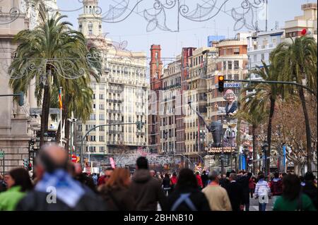 VALENCIA, SPAIN - MARCH 18, 2010: Busy atmosphere in the town hall square of Valencia, during the celebration of the Fallas in 2010, with the Falla de Stock Photo