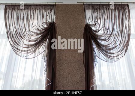 Beautiful curtains in the afternoon, against the light.  Stock Photo