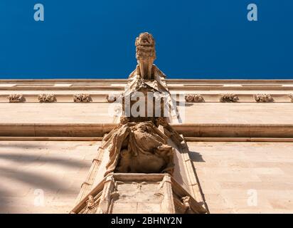 Palma de Mallorca, Spain; 09/17/2014: lion-shaped gargoyle seen from below. Belongs to the historic building of La Lonja in Palma de Mallorca Stock Photo