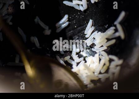 Dirty dishes stacked next to sink in home kitchen Stock Photo
