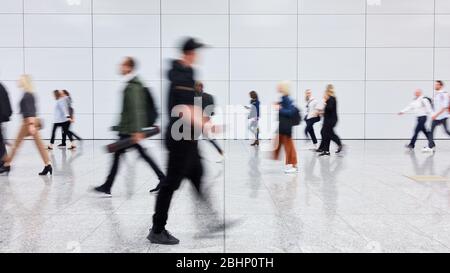 Anonymous group of people goes shopping in the mall Stock Photo