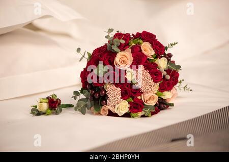 Wedding bouquet of roses on a sheet Stock Photo
