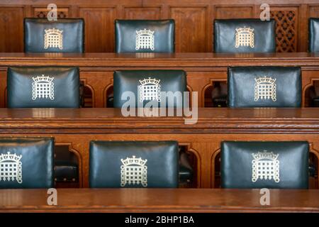 Empty seats in the Palace of Westminster. House of Commons meeting room. Stock Photo