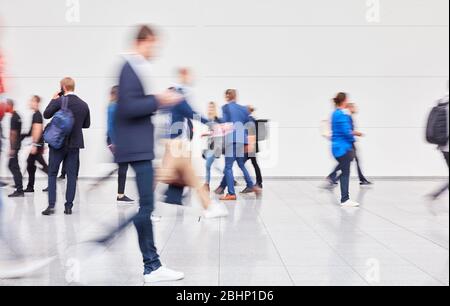 Anonymous blurred crowd in motion at convention or convention Stock Photo