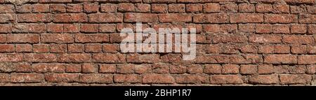 Panorama of the building walls. Old brick wall destroyed by time. Stock Photo