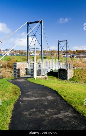 New bridge carrying cycle route 47 across river, Taff Bargoed Community Park near Merthyr Tydfil, South Wales. Stock Photo
