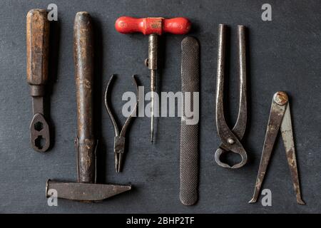 very old tools on black background Stock Photo