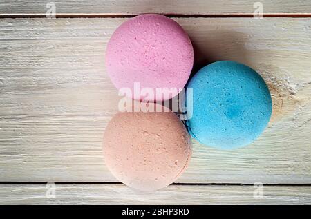 Three macaroons near in white desk Stock Photo