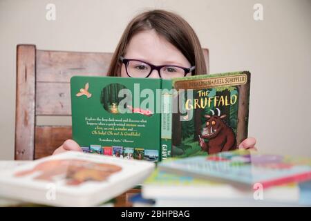 Four year old girl being home schooled Stock Photo