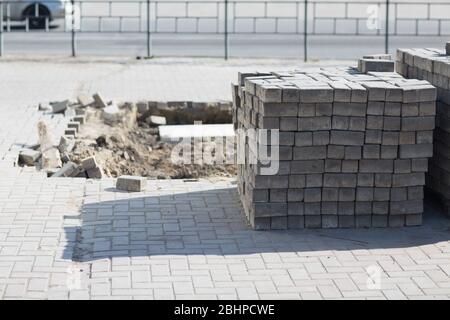 Stacked road tiles. Broken surface. Stock Photo