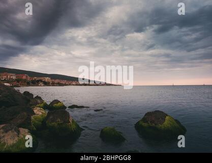 Time before the storm. Dramatic sky. Thunderstorm on the shore of a tourist city. Stock Photo