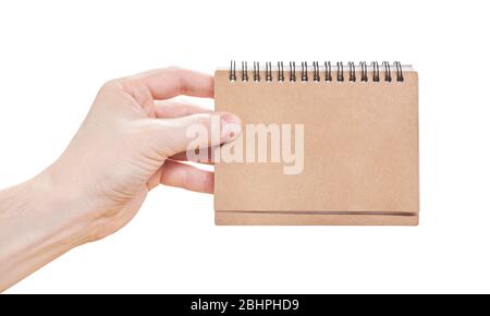 Male hands holding pad of paper isolated on a white background. Close up Stock Photo