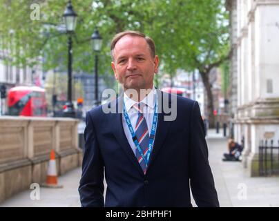 London, UK. 27th Apr, 2020. Sir Simon Stevens, CEO of the National Health Service, arrives at Downing Street for the Covid-19 meeting, Stock Photo
