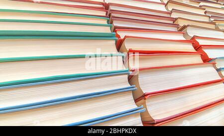 Books pile low angle view. Texture and background with selective focus Stock Photo