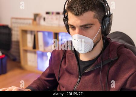 Coronavirus. Business workers working from home wearing protective mask. Small company in quarantine for coronavirus working from home with sanitizer Stock Photo