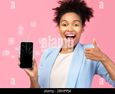 Woman using smart phone with flying network Stock Photo