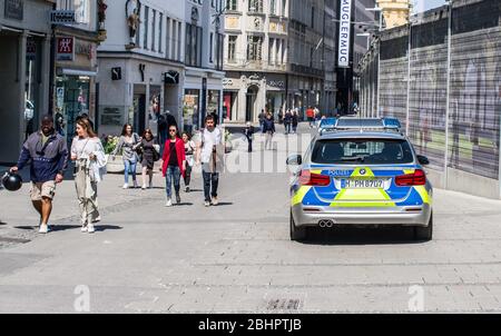 Munich, Bavaria, Germany. 25th Apr, 2020. A vehicle from the Munich police in Germany patrols the streets of the inner city looking for violations of the Infectionsschutzgesetz (Infection Protection Laws) Credit: Sachelle Babbar/ZUMA Wire/Alamy Live News Stock Photo