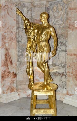 St. BartholomewExquisite Pain - a gilded bronze sculpture by Damien Hirst Stock Photo