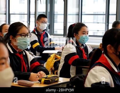 Shanghai. 27th Apr, 2020. Students of grade 9 attend a class at the No. 1 Middle School Affiliated to East China Normal University in east China's Shanghai, April 27, 2020. Senior students in junior and senior high schools in Shanghai resumed classes on Monday. Credit: Liu Ying/Xinhua/Alamy Live News Stock Photo