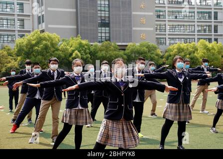Shanghai. 27th Apr, 2020. Students of grade 12 do physical exercise at the No. 1 High School Affiliated to East China Normal University in east China's Shanghai, April 27, 2020. Senior students in junior and senior high schools in Shanghai resumed classes on Monday. Credit: Liu Ying/Xinhua/Alamy Live News Stock Photo