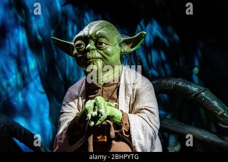 London, England, UK - January 2, 2020: Waxwork statues of Master Yoda from Star Wars, Madame Tussauds waxwork museum, one of the popular touristic att Stock Photo