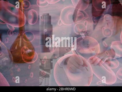 Cells of red blood cells and Covid-19 coronavirus spreading and a female doctor scientist in backgro Stock Photo