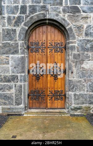 The door of the Bergenhus, harborside stone fortress and museum in Bergen, Norway Stock Photo