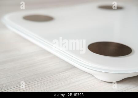 Smart scales with bioelectric impedance analysis, BIA, measuring body fat,  on the background of blurry female legs Stock Photo - Alamy