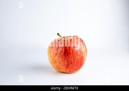 Isolated apples. Whole red apple and a half isolated on white background with clipping path Stock Photo