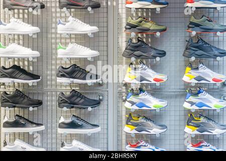 Leiden, The Netherlands - January 16, 2020: Display of different sports shoes in a store window in Leiden, The Netherlands Stock Photo