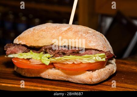 Sandwiches display during fast food festival outdoor event. Outside catering. Food Buffet Catering Dining Eating Party Sharing Concept. Meat, bacon, c Stock Photo